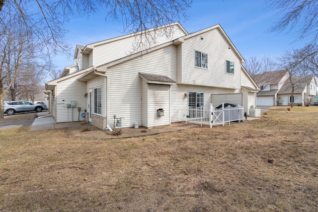 rear view of property featuring central AC unit