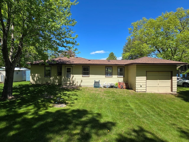 16099 Twilight Rd, Kathio Twp, MN 56359 - view of front of property featuring a garage, a front lawn, and a shed