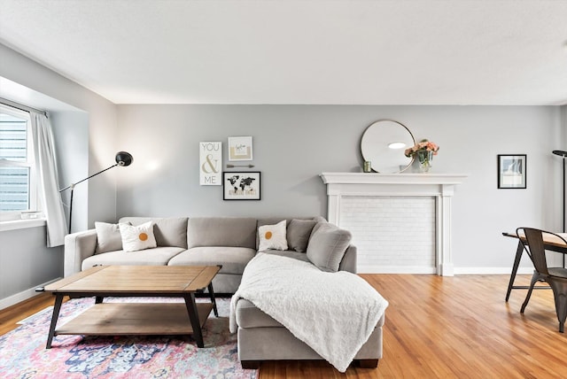 7986 Lad Pkwy, Brooklyn Park, MN 55443 - living room with light wood-type flooring and baseboards