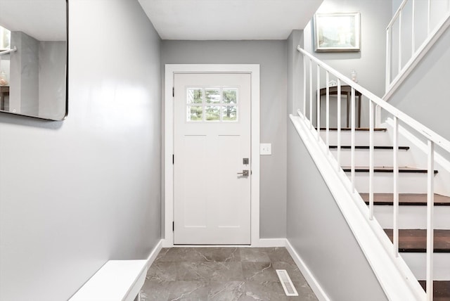 7986 Lad Pkwy, Brooklyn Park, MN 55443 - doorway featuring stairs, baseboards, and marble finish floors