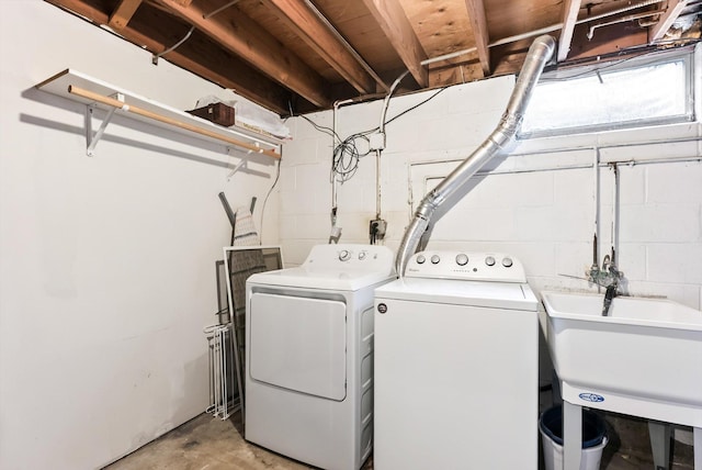 7986 Lad Pkwy, Brooklyn Park, MN 55443 - laundry area with separate washer and dryer and concrete block wall