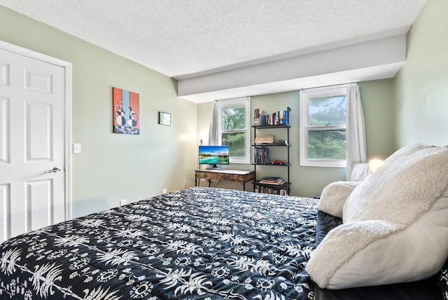 7986 Lad Pkwy, Brooklyn Park, MN 55443 - bedroom featuring a textured ceiling