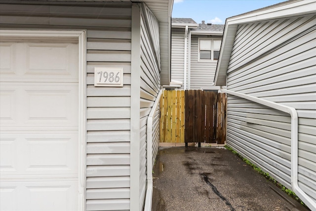 7986 Lad Pkwy, Brooklyn Park, MN 55443 - doorway to property with a garage