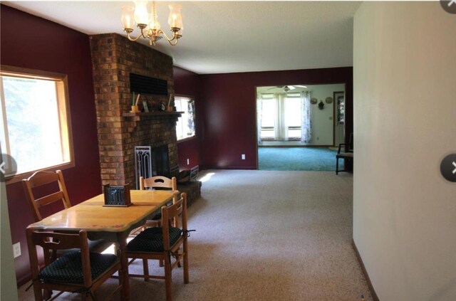 42491 432nd Ln, Aitkin, MN 56431 - carpeted dining area featuring a notable chandelier and a fireplace