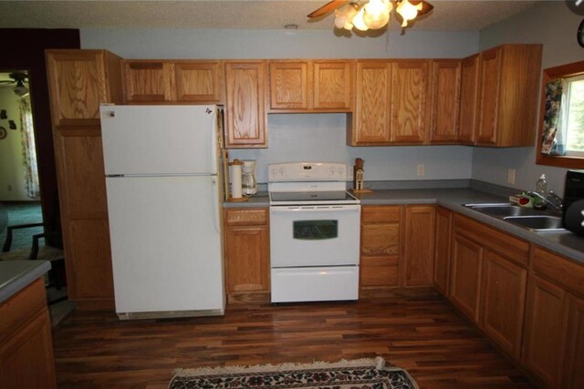42491 432nd Ln, Aitkin, MN 56431 - kitchen with a ceiling fan, a sink, dark wood-style floors, and white appliances