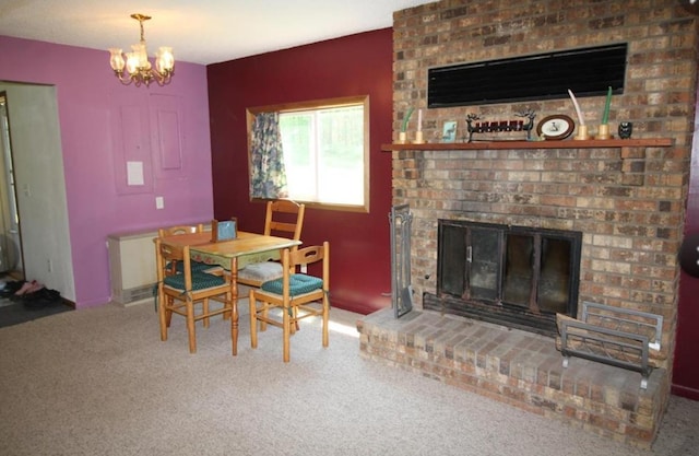 42491 432nd Ln, Aitkin, MN 56431 - carpeted dining space featuring a fireplace and a chandelier