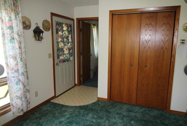 42491 432nd Ln, Aitkin, MN 56431 - unfurnished bedroom featuring a closet, baseboards, and carpet