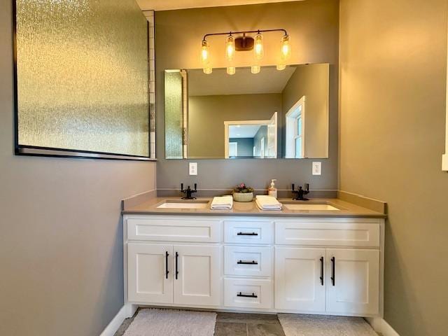 817 2nd St N, Brownsville, MN 55919 - full bath with double vanity, baseboards, and a sink