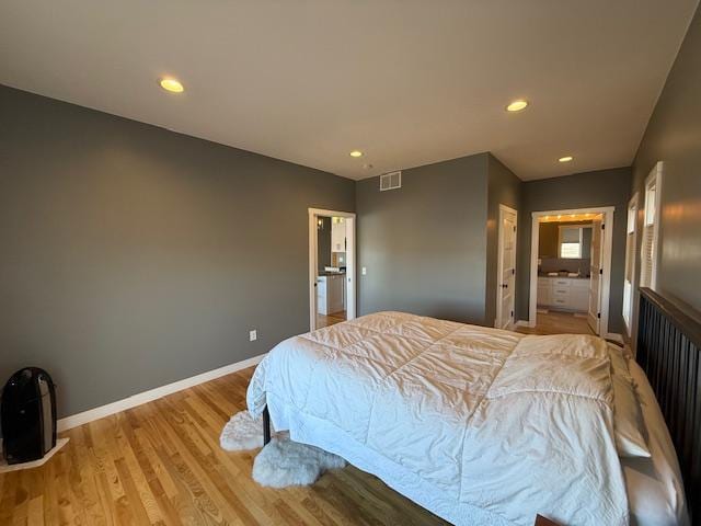 817 2nd St N, Brownsville, MN 55919 - bedroom featuring baseboards, recessed lighting, light wood-style flooring, and visible vents