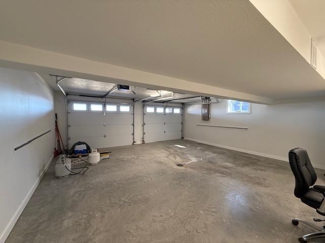 817 2nd St N, Brownsville, MN 55919 - garage with baseboards and a garage door opener
