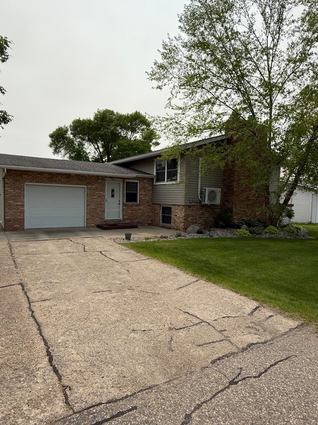 404 Balmoral Ave, Henning, MN 56551 - view of front of house featuring an attached garage, driveway, brick siding, and a front yard
