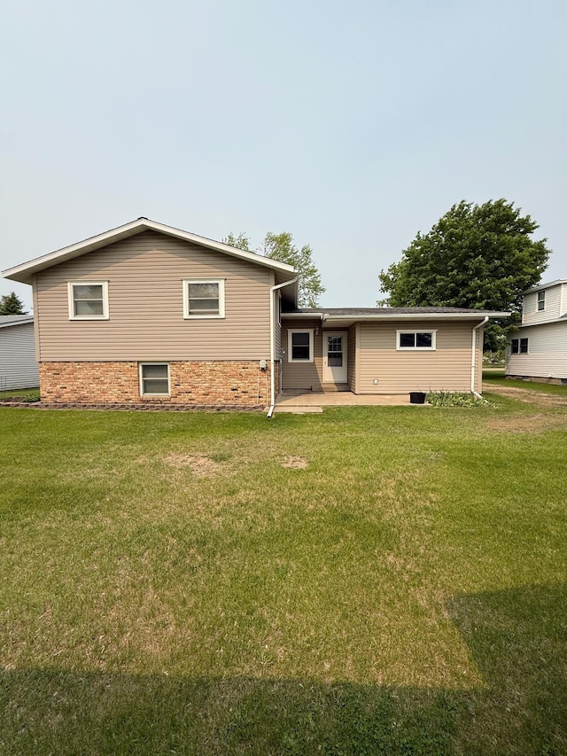 404 Balmoral Ave, Henning, MN 56551 - rear view of property with a yard and a patio area