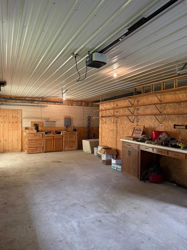 404 Balmoral Ave, Henning, MN 56551 - garage with a workshop area and a garage door opener