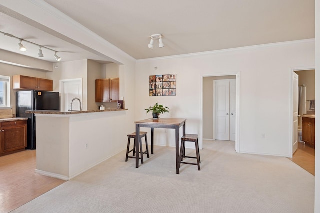 13560 Technology Dr Unit 1210, Eden Prairie, MN 55344 - dining room with ornamental molding, rail lighting, and light carpet