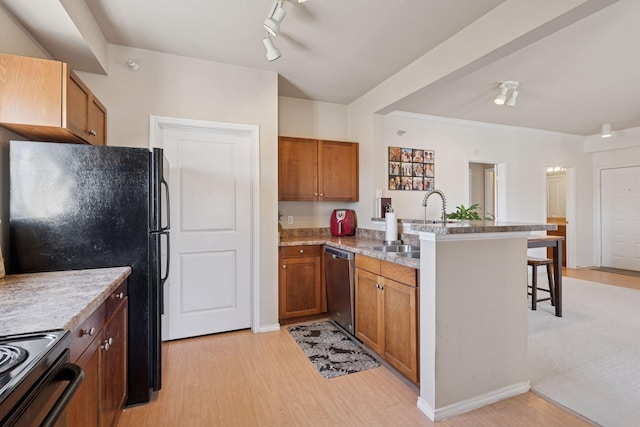 13560 Technology Dr Unit 1210, Eden Prairie, MN 55344 - kitchen with a peninsula, stainless steel appliances, brown cabinets, and light wood-type flooring