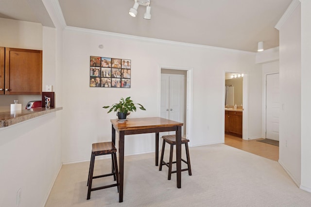 13560 Technology Dr Unit 1210, Eden Prairie, MN 55344 - dining area with light carpet and ornamental molding
