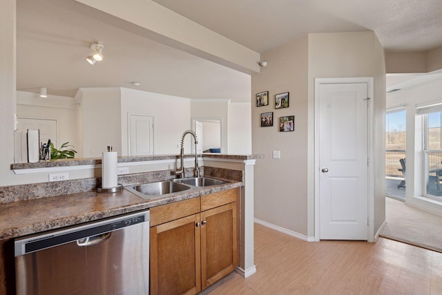 13560 Technology Dr Unit 1210, Eden Prairie, MN 55344 - kitchen featuring stainless steel dishwasher, brown cabinetry, light wood-style floors, and dark countertops