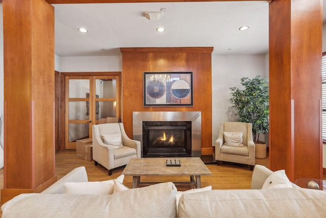 13560 Technology Dr Unit 1210, Eden Prairie, MN 55344 - living area featuring wood finished floors, a glass covered fireplace, and recessed lighting