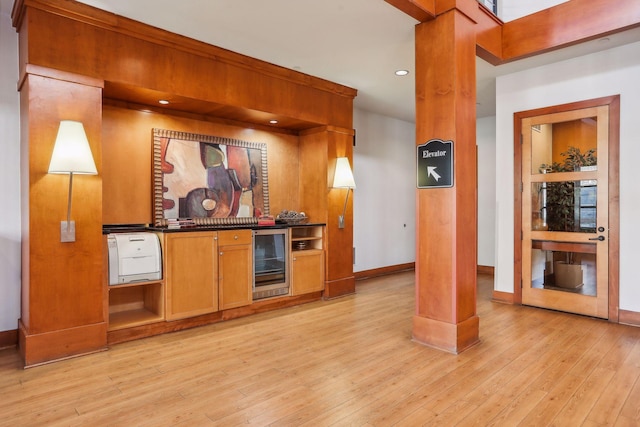 13560 Technology Dr Unit 1210, Eden Prairie, MN 55344 - bar area with beverage cooler, light wood-style floors, decorative columns, and recessed lighting