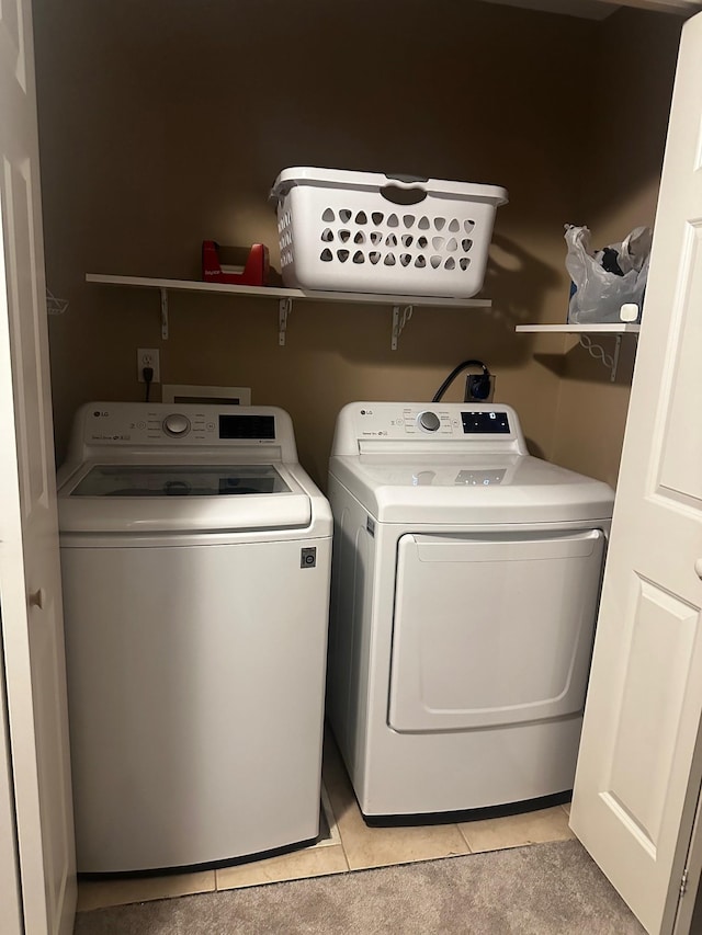 7048 Park Dr, Savage, MN 55378 - clothes washing area featuring light tile patterned flooring, independent washer and dryer, and laundry area