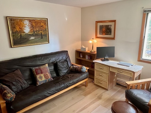 office featuring light wood-style flooring and baseboard heating