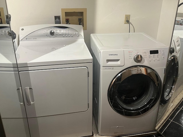 laundry room with washer and dryer