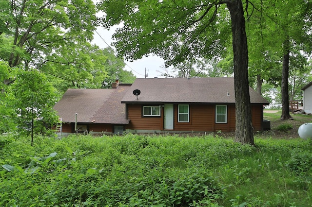 27672 Little Whitefish Rd, Garrison, MN 56450 - view of home's exterior featuring roof with shingles and a chimney