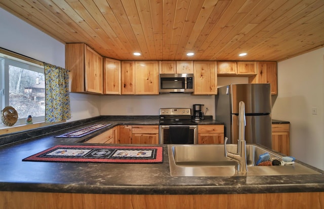 27672 Little Whitefish Rd, Garrison, MN 56450 - kitchen featuring appliances with stainless steel finishes, wooden ceiling, dark countertops, recessed lighting, and a peninsula