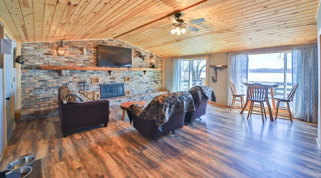 27672 Little Whitefish Rd, Garrison, MN 56450 - living area featuring wooden ceiling, vaulted ceiling, a ceiling fan, wood finished floors, and a brick fireplace