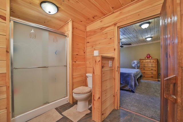 27672 Little Whitefish Rd, Garrison, MN 56450 - bathroom featuring toilet, a stall shower, wooden walls, and wooden ceiling