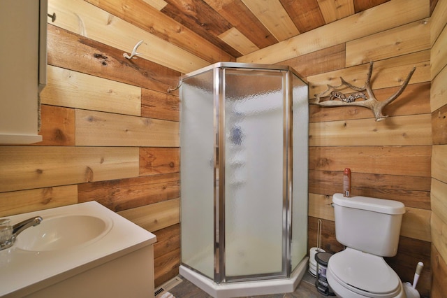27672 Little Whitefish Rd, Garrison, MN 56450 - full bath featuring wooden walls, a shower stall, wooden ceiling, vanity, and toilet