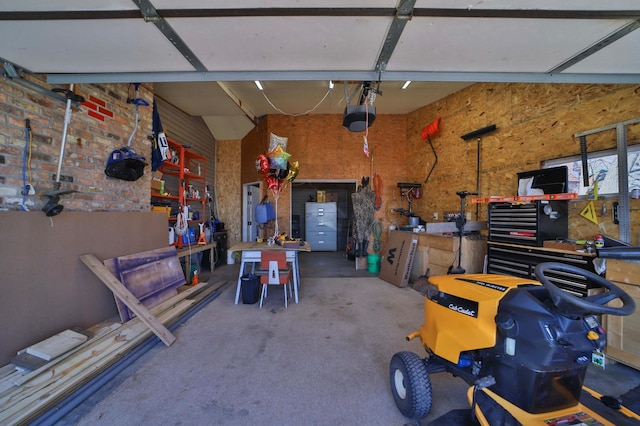 27672 Little Whitefish Rd, Garrison, MN 56450 - garage featuring a workshop area and a garage door opener