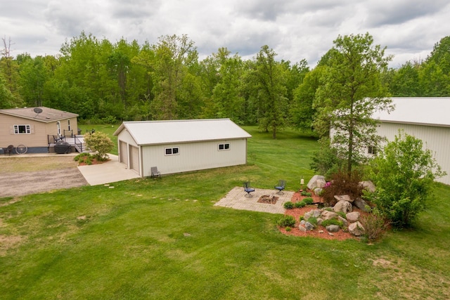 42479 US-71, Laporte, MN 56461 - view of green lawn featuring an outdoor structure, a garage, and a fire pit