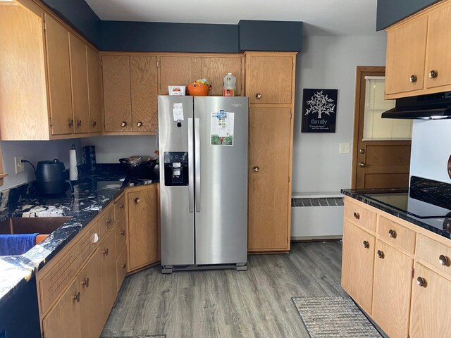 713 Maple Dr, Aurora, MN 55705 - kitchen with light wood-style flooring, under cabinet range hood, a sink, and stainless steel fridge with ice dispenser