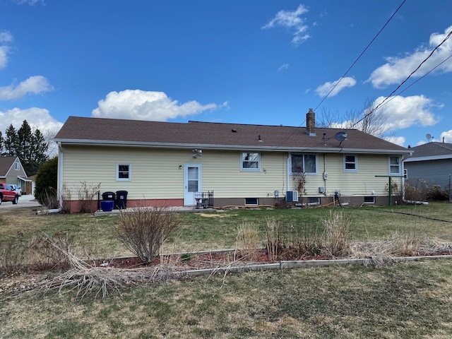 713 Maple Dr, Aurora, MN 55705 - back of house featuring central air condition unit, a chimney, and a yard