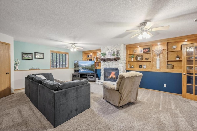 108 Serenity Cir, Buffalo, MN 55313 - carpeted living room featuring ceiling fan, a textured ceiling, and a fireplace