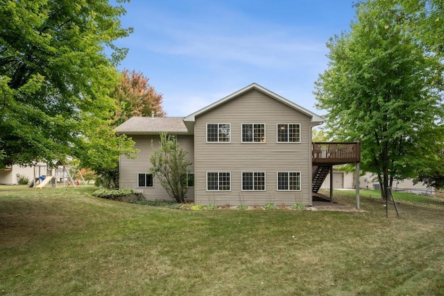 108 Serenity Cir, Buffalo, MN 55313 - back of property featuring stairway, a wooden deck, and a playground