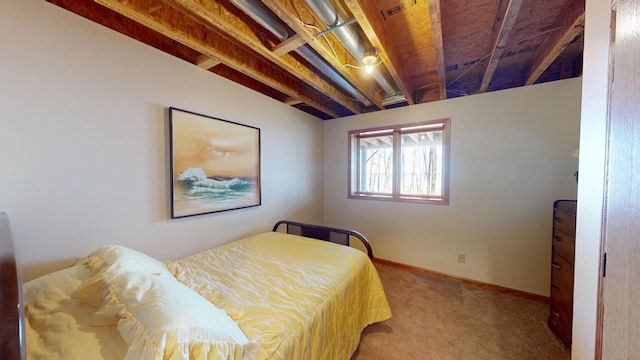 bedroom featuring baseboards and carpet