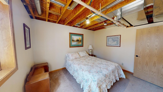 bedroom featuring carpet floors and baseboards