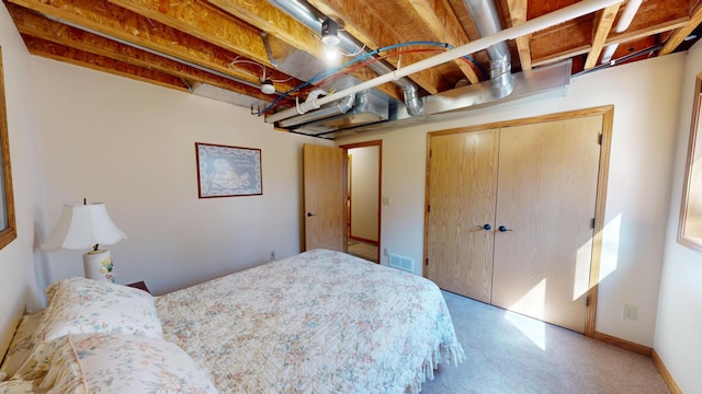 bedroom featuring a closet and visible vents