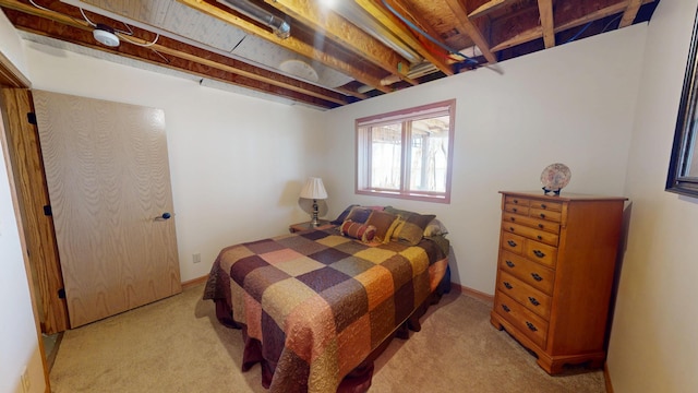 bedroom featuring light carpet