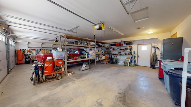 garage featuring a garage door opener