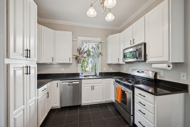 4336 Aldrich Ave S, Minneapolis, MN 55409 - kitchen with appliances with stainless steel finishes, dark countertops, dark tile patterned flooring, white cabinets, and a sink