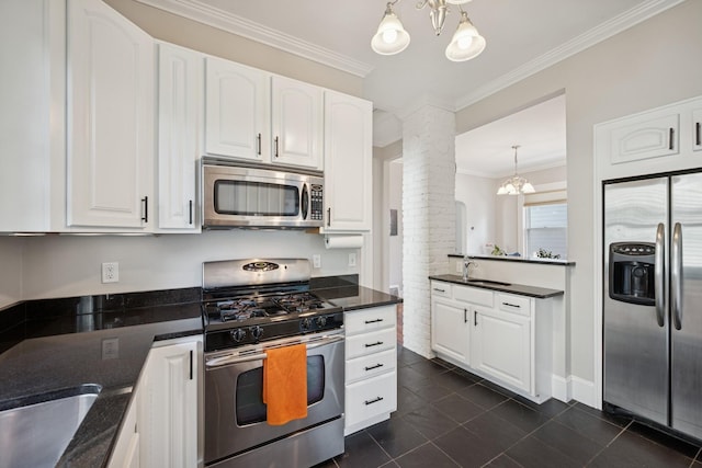 4336 Aldrich Ave S, Minneapolis, MN 55409 - kitchen featuring appliances with stainless steel finishes, decorative columns, a chandelier, white cabinetry, and ornamental molding