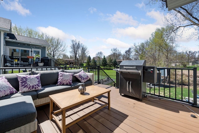 wooden terrace with an outdoor living space, a yard, and a grill