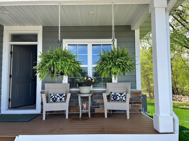 wooden deck featuring covered porch