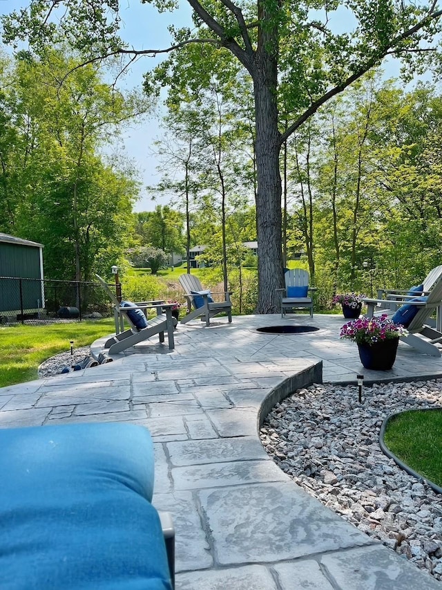 surrounding community featuring fence and a patio