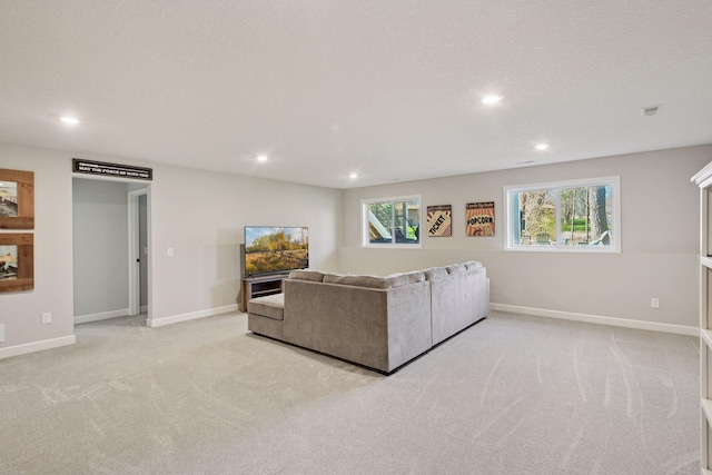 living area with recessed lighting, baseboards, visible vents, and light carpet