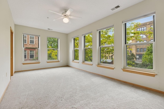 645 1st St Unit 411, Minneapolis, MN 55401 - unfurnished room with carpet flooring, baseboards, and a ceiling fan