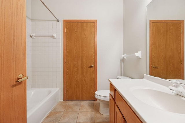 645 1st St Unit 411, Minneapolis, MN 55401 - bathroom featuring vanity, toilet, tile patterned flooring, and tub / shower combination